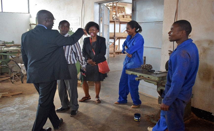 At Salima Technical College – NAO-SU Head of Operations, Charles Lumanga shares a joke with team members including NAO-SU Education Sector Manager Susan Komwa (C) and the College Principal (2nd L) At Salima Technical College – NAO-SU Head of Operations, Charles Lumanga shares a joke with team members including NAO-SU Education Sector Manager Susan Komwa (C) and the College Principal (2nd L)